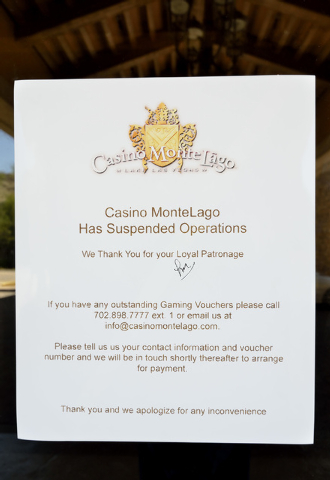 A sign with information about the closure of Casino MonteLago at Lake Las Vegas is shown at 30 Strada di Villaggio in Henderson on Thursday, July 3, 2014. (Bill Hughes/Las Vegas Review-Journal)