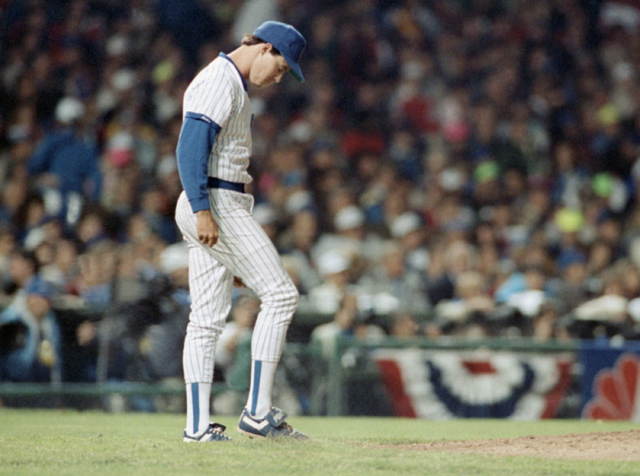 Cubs pitcher Greg Maddux looks down in dejection after San Francisco Giants Will Clark clipped him for a home run in the third inning of the NL playoff game, Wednesday, Oct. 4, 1989, Chicago, Ill. ...