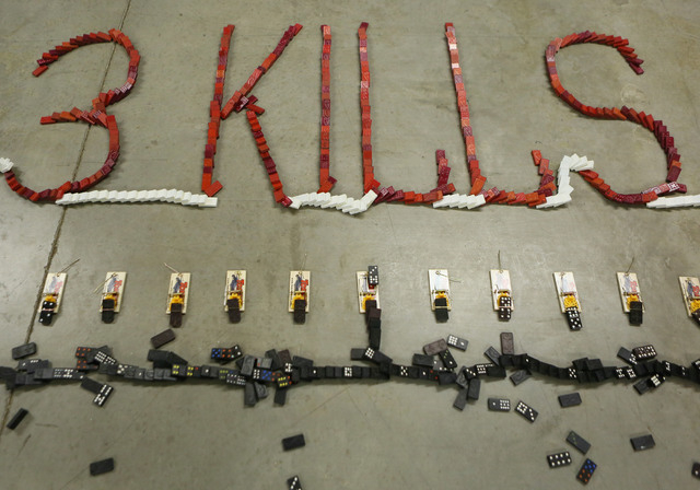 A domino demonstration is shown after the dominoes have fallen during a news conference at Nevada Policy Research Institute Tuesday, July 22, 2014, in Las Vegas. The 3,610 dominoes, which were pla ...