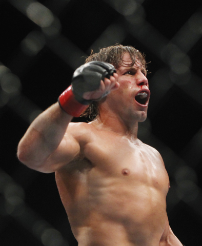 Urijah Faber celebrates after earning a submission victory over Alex Caceres during UFC 175 at the Mandalay Bay Events Center in Las Vegas on Saturday, July 5, 2014. (Jason Bean/Las Vegas Review-J ...