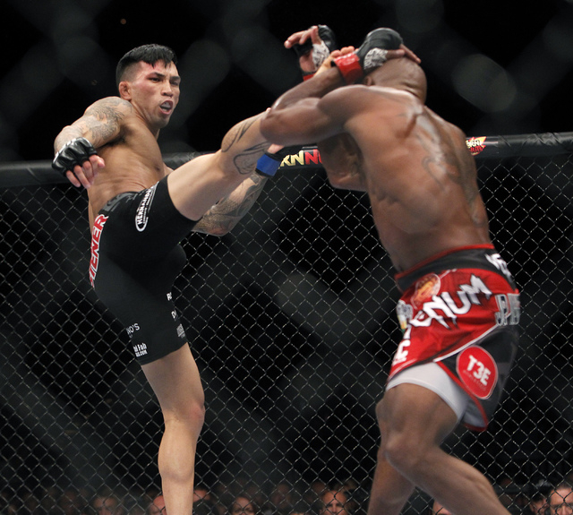 Russel Doane, left, kicks Marcus Brimage during UFC 175 at the Mandalay Bay Events Center in Las Vegas on Saturday, July 5, 2014. (Jason Bean/Las Vegas Review-Journal)