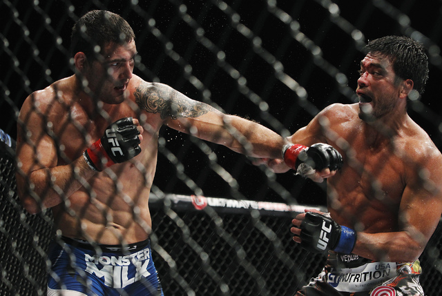 Chris Weidman, left, takes on Lyoto Machida during UFC 175 at the Mandalay Bay Events Center in Las Vegas on Saturday, July 5, 2014. (Jason Bean/Las Vegas Review-Journal)