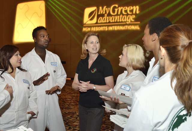 Patty Coaley, center, executive director of diversity and inclusion for MGM Resorts International, talks with volunteers from MGM properties before they take the stage as a dance team for a show d ...