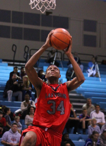 Las Vegas’ Re’Kwon Smith (34) jumps for a slam dunk against Foothill earlier thi ...