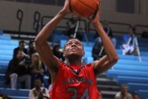 Las Vegas’ Re’Kwon Smith (34) jumps for a slam dunk against Foothill earlier thi ...