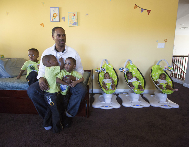 Deon Derrico with six of his nine children at their home in North Las Vegas on Monday, March 24, 2014. His wife Evonne Derrico gave birth to quintuplets on Sept. 6. (Jeff Scheid/Las Vegas Review-J ...