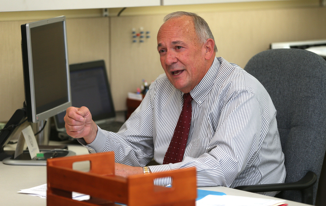 Romaine Gilliland, the new director of the Nevada Department of Health and Human Services, is seen in his office in Carson City, Nev., on Monday, June 30, 2014.
Photo by Cathleen Allison