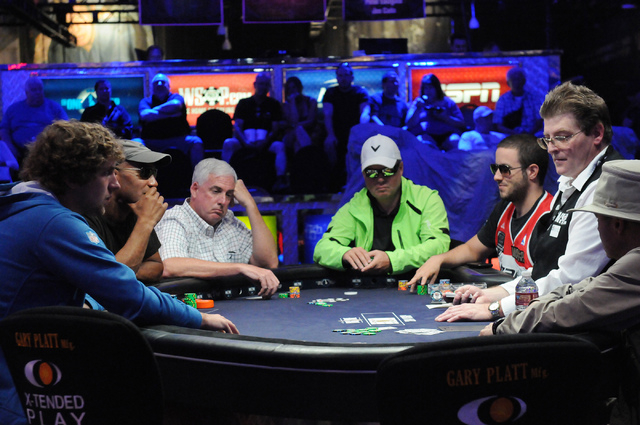 Players compete on the main stage inside the the Amazon room during the 2014 World Series of Poker event at the Rio Convention Center in Las Vegas Saturday, July 5, 2014. (Erik Verduzco/Las Vegas  ...