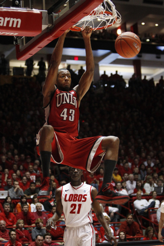 UNLV Rebels basketball player Mike Moser (43) dunks against the New Mexico Lobos in the first half of their game at The Pit in Albuquerque, N.M., on Saturday, Feb. 18, 2012. (John Locher/Las Vegas ...