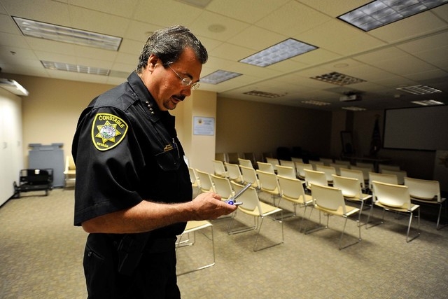 Las Vegas Township Constable John Bonaventura checks his phone in his downtown Las Vegas office on Tuesday, May 27, 2014. (David Becker/Las Vegas Review-Journal)