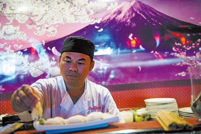 Steve Wei makes sushi at Ohjah Japanese Steakhouse in Las Vegas on Saturday, May 24, 2014. The restaurant has been open for over two years and features sushi and hibachi. (Jacob Kepler/Las Vegas R ...