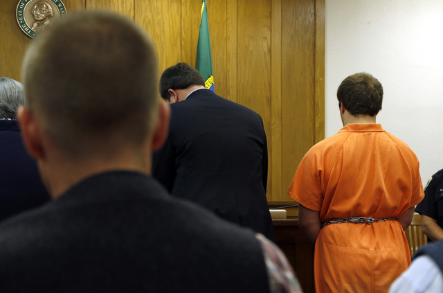 Gabriel Gaeta, right, stands next to his lawyer at a hearing in Kitsap County Superior Court, on Monday, Aug. 11, 2014, in Port Orchard, Wash. A judge found probable cause to detain the 17-year-ol ...