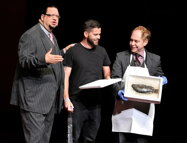 Penn Jillette, left, and Teller of Penn & Teller perform with a member of the audience during their show at the Rio on Monday, Aug. 18, 2014. (David Becker/Las Vegas Review-Journal)