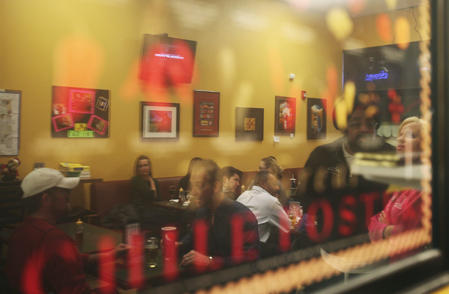 Diners can be seen reflected in glass at Carlito's Burritos Las Vegas. (Jason Bean/Las Vegas Review-Journal File)