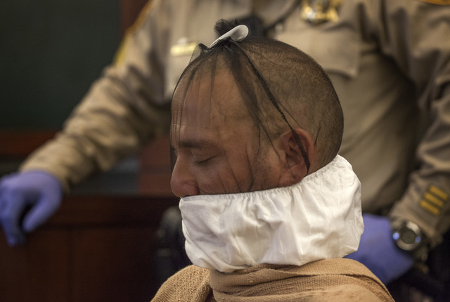 Scott Carmitchel makes his first appearance in  Regional Justice Center on Wednesday, July 30, 2014. Carmitchel had a spit mask wrapped around his face. He is facing charges of battery, grand larc ...