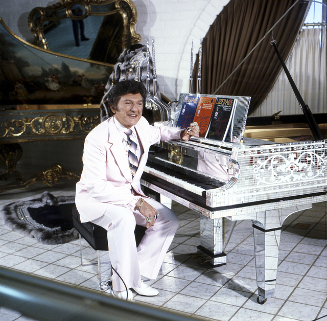 Photo courtesy Las Vegas News Bureau 
Liberace poses at a piano in his namesake museum at when it opened at 1775 E. Tropicana Ave. in 1979.