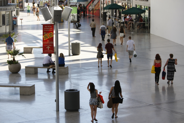 People walk along Fashion Show mall near their Strip entrance where an expansion and redevelopment is planned to accommodate more restaurants and retail stores in Las Vegas Tuesday, Aug. 26, 2014. ...