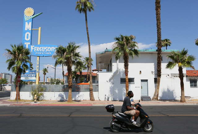 A man rides past Fergusons Motel, located at 1028 East Fremont St. Friday, Aug. 1, 2014, in Las Vegas. Downtown Project plans to transform the closed hotel into a retail center. (Ronda Churchill/L ...
