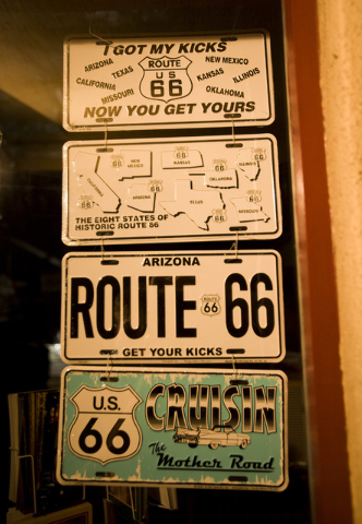 A Route 66 license plate in the window at the Peace Surplus in downtown Flagstaff, Arizona, on July 11, 2009. The famous highway went through Flagstaff. (JEFF SCHEID/LAS VEGAS REVIEW-JOURNAL)