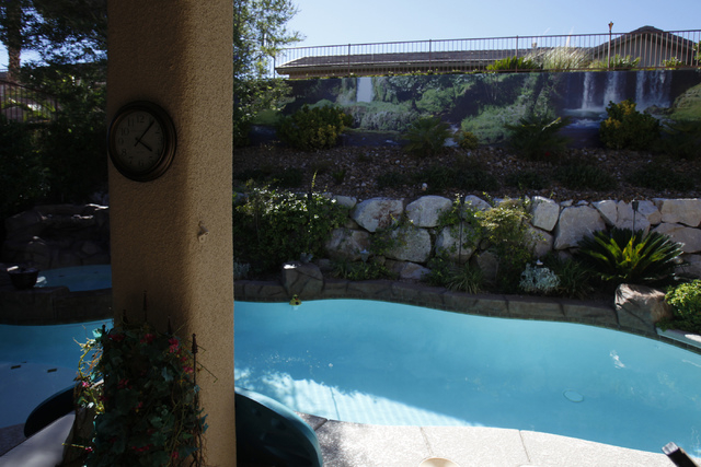 A waterfall scene print created by Wall Sensations decorates a backyard wall at the home of Roger Weaver in Las Vegas Friday, Aug. 15, 2014. (Erik Verduzco/Las Vegas Review-Journal)
