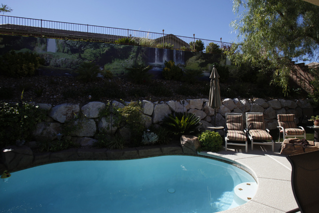 A waterfall scene print created by Wall Sensations decorates a backyard wall at the home of Roger Weaver in Las Vegas Friday, Aug. 15, 2014. (Erik Verduzco/Las Vegas Review-Journal)