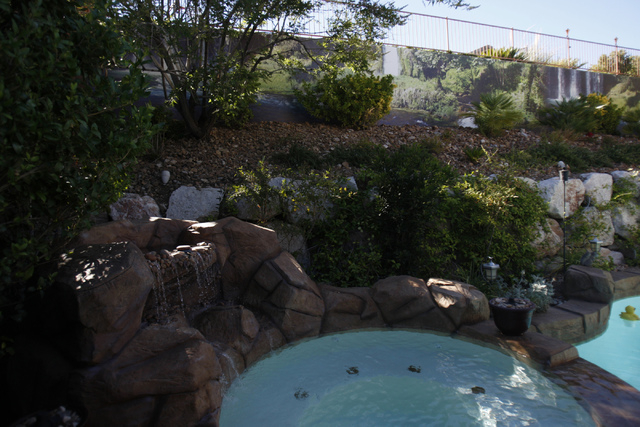 A waterfall scene print created by Wall Sensations decorates a backyard wall at the home of Roger Weaver in Las Vegas Friday, Aug. 15, 2014. (Erik Verduzco/Las Vegas Review-Journal)