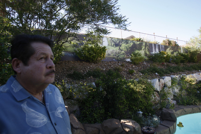 A waterfall scene print created by Wall Sensations decorates a backyard wall at the home of Roger Weaver in Las Vegas Friday, Aug. 15, 2014. (Erik Verduzco/Las Vegas Review-Journal)