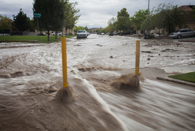 A flooded Shade Pines Drive in northwest Las Vegas as seen on Monday, Aug. 4, 2014. Overnight monsoon rains caused flooding in the area.
(Jeff Scheid/Las Vegas Review-Journal)