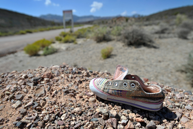 A child's shoe is seen near the perimeter of the well-guarded military installation on Tuesday, Aug. 5, 2014. The super secret site, known as Area 51, is full of conspiracy theories about extra-te ...