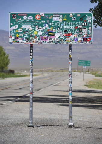 The Extraterrestrial Highway sign, covered with stickers, is seen along star route 375 on Tuesday, Aug. 5, 2014. State officials drew inspiration from the alien legends at Area 51and dubbed the ...