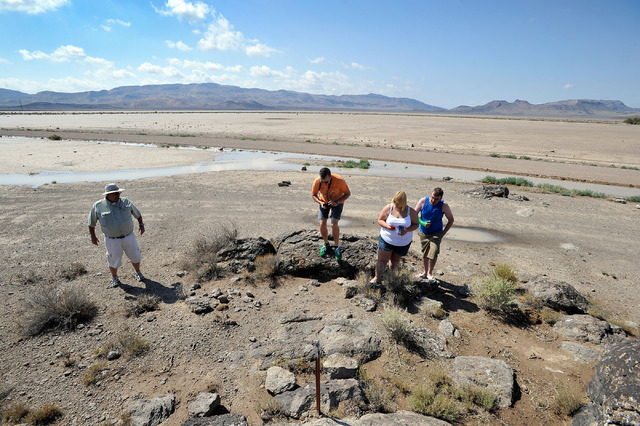 Dean Baumgartner, left, of Adventure Photo Tours, leads tourists Floris Otten, second left, of The Netherlands and Becky Cooper and Shane Cooper of England, on a tour of Delamar Dry Lake on Tuesd ...