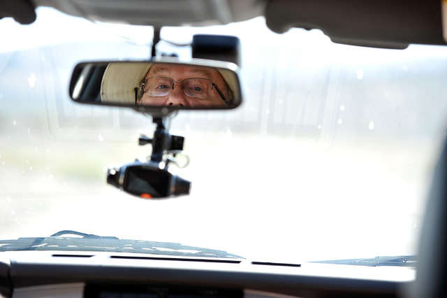 Dean Baumgartner, of Adventure Photo Tours, keeps his eyes on his passengers as he shares stories related the super secret military base, known as Area 51, and its conspiracy theories about extra- ...