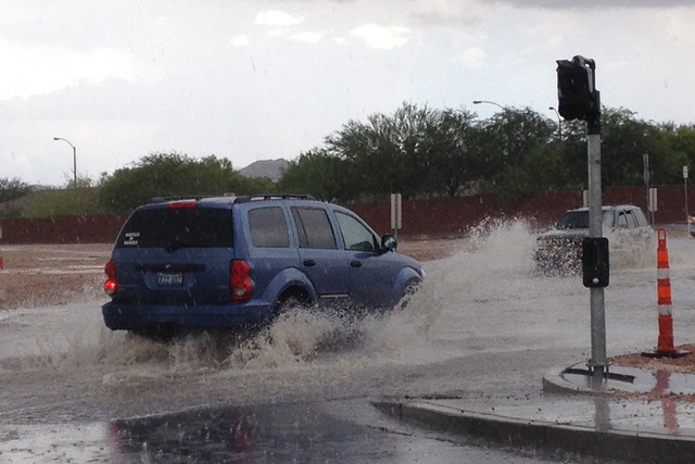 Flooding is seen at the intersection of Blue Diamond and Durango on Monday, August 4, 2014. (Jason Bean/Las Vegas Review-Journal)