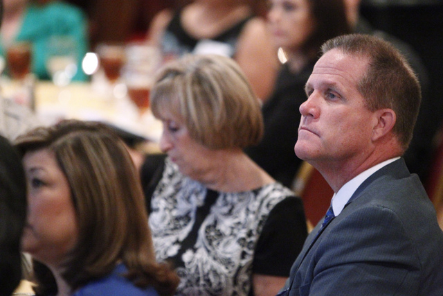 State Sen. Mark Hutchison, R-Las Vegas, listens to U.S. Sen. Harry Reid, D-Nev., during the Asian Chamber of Commerce's monthly lunch at the Gold Coast casino-hotel in Las Vegas Thursday, Aug. 21, ...