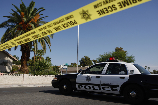 The scene of a home invasion and shooting at the corner of Autumn Street and Rollingwood Drive in Las Vegas Tuesday, July 29, 2014. (Erik Verduzco/Las Vegas Review-Journal)