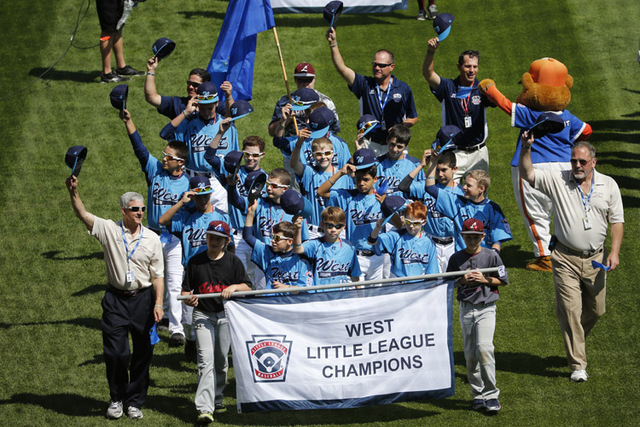The Mountain Ridge Little League baseball team from Las Vegas participates in the opening ceremony of the 2014 Little League World Series tournament in South Williamsport, Pa., Thursday, Aug. 14,  ...