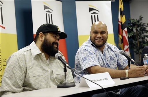 Chris Kemoeatu, left, and his brother Ma'ake laugh during a news conference at the University of Maryland Medical Center, Wednesday, Sept. 17, 2014, in Baltimore. Chris Kemoeatu's football career ...