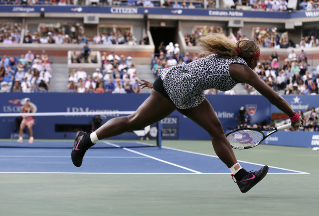 Serena Williams, returns a shot against Caroline Wozniacki, of Denmark, during the championship match of the 2014 U.S. Open tennis tournament, Sunday, Sept. 7, 2014, in New York. (AP Photo/Charles ...