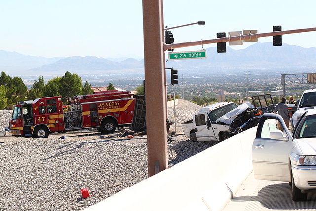 Three vehicles are involved in an accident on northbound 215 Beltway near Summerlin Parkway. One vehicle was reported on fire. (Chase Stevens/Las Vegas Review-Journal)