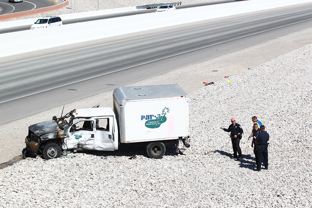 Three vehicles are involved in an accident on northbound 215 Beltway near Summerlin Parkway. One vehicle was reported on fire. (Chase Stevens/Las Vegas Review-Journal)