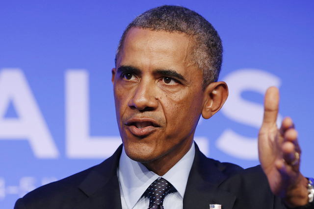 U.S. President Barack Obama answers a question at a news conference at the conclusion of the NATO Summit at the Celtic Manor Resort in Newport, Wales September 5, 2014. (REUTERS/Larry Downing)