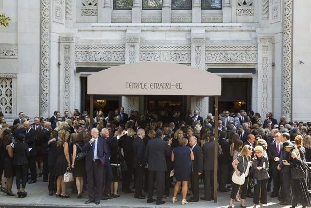 Mourners depart the funeral of comedian Joan Rivers at Temple Emanu-El in New York September 7, 2014. REUTERS/Lucas Jackson (UNITED STATES - Tags: ENTERTAINMENT OBITUARY)