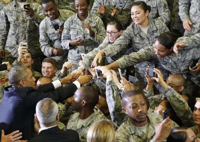 U.S. President Barack Obama shakes hands with soldiers after he speaks after a military briefing at U.S. Central Command at MacDill Air Force Base in Tampa, Florida, on Wednesday, Sept. 17, 2014.  ...