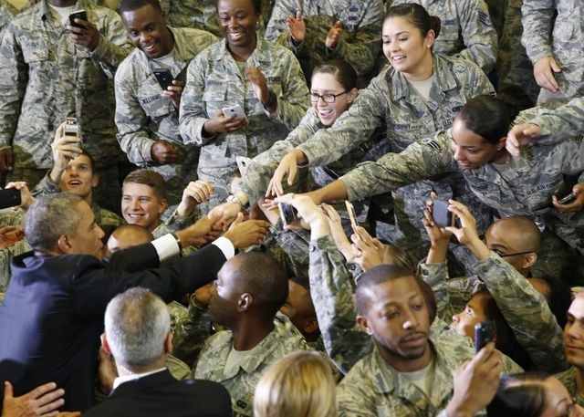 U.S. President Barack Obama shakes hands with soldiers after he speaks after a military briefing at U.S. Central Command at MacDill Air Force Base in Tampa, Florida, on Wednesday, Sept. 17, 2014. ...