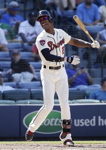 Atlanta Braves' B.J. Upton reacts after striking out in the seventh inning of a baseball game against the New York Mets, Sunday, Sept. 21, 2014, in Atlanta. (AP Photo/David Goldman)