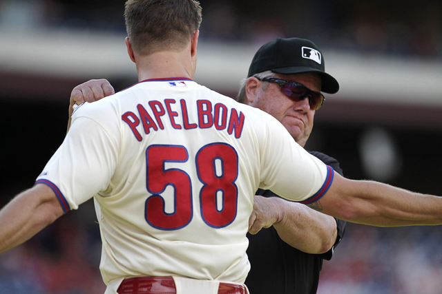 Philadelphia Phillies pitcher Jonathan Papelbon argues with Umpire Joe West after being ejected from the game against the Miami Marlins in the ninth inning of a baseball game Sunday, Sept. 14, 201 ...