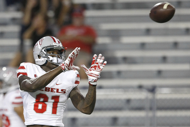 UNLV wide receiver Devante Davis (81) against Arizona during the first half of the NCAA college football game, Friday, Aug. 29, 2014, in Tucson, Ariz. (AP Photo/Rick Scuteri)