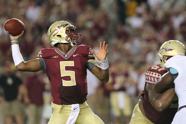 Florida State's Jameis Winston passes against The Citadel in the third quarter of an NCAA college football game on Saturday, Sept. 6, 2014 in Tallahassee, Fla. (AP Photo/Steve Cannon)