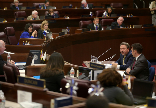 Tony Sanchez of NV Energy, left, and Paul Thomsen, with the Nevada Office of Energy, answer questions from lawmakers during a special session of the Nevada Legislature in Carson City on Wednesday, ...