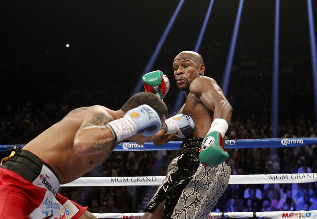 Mayweather survives rough tactics, remains undefeated ...